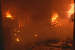 A still from Alhurra TV footage shows furniture burning at the site of the attack on the U.S. Consulate in Benghazi, Libya.