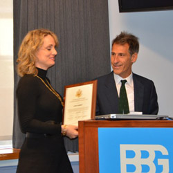 Karen Caballero of Radio and TV Martí receives a Burke Award from BBG Presiding Gov. Michael Linton.