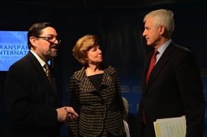 Gustavo Win, a development officer with BBG, left, speaks with Huguette Labelle of Transparency International and Alan Larsen of Transparency International USA