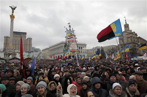 Pro-European Union activists attend a rally in Independence Square in Kyiv, Ukraine, Sunday, Jan. 12, 2014. Tens of thousands of activists rallied in the center of the Ukrainian capital on Sunday, while the organizers of the weeks-long anti-government protests looked for a future strategy amid dwindling numbers and a continuing government crackdown on the protesters. (AP Photo/Sergei Chuzavkov)