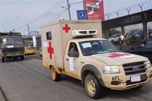 Liberian soldiers in a medical truck, with papers on it reading 'EBOLA MOST GO' drive past as they patrol streets to prevent panic, as fears of the deadly Ebola virus spread in the city of Monrovia, Liberia, Friday, Aug 1, 2014. (AP Photo/Abbas Dulleh)