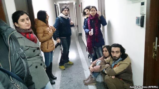 Baku-based RFE/RL Azerbaijani Service journalists forced from their bureau during raid by police and investigators, 26Dec2014