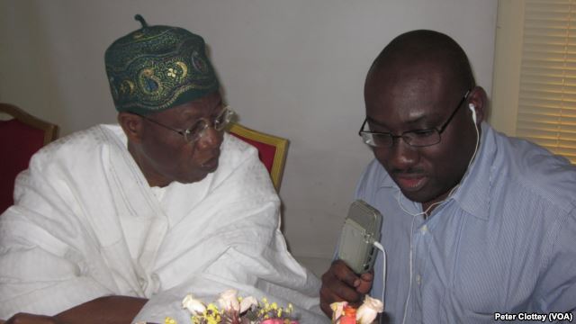 Alhaji Lai Mohammed, spokesman for the All Progressives Congress (L), with VOA English to Africa reporter Peter Clottey